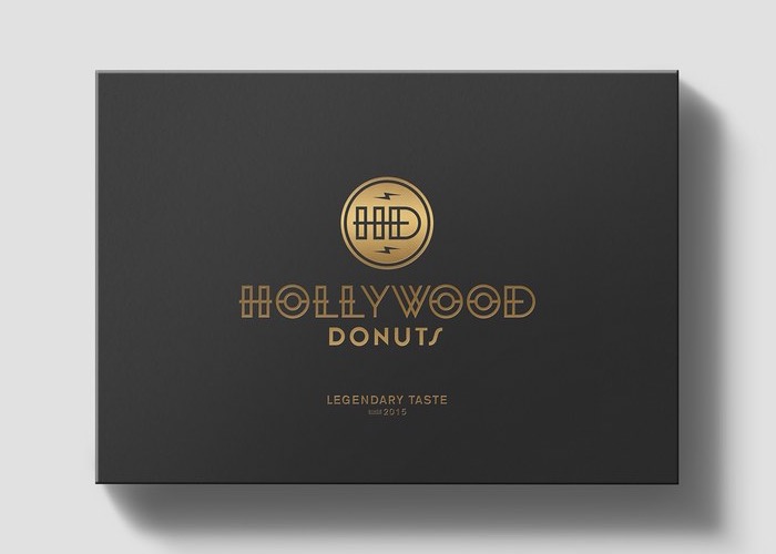 Hollywood Donuts black brand card with gold logo